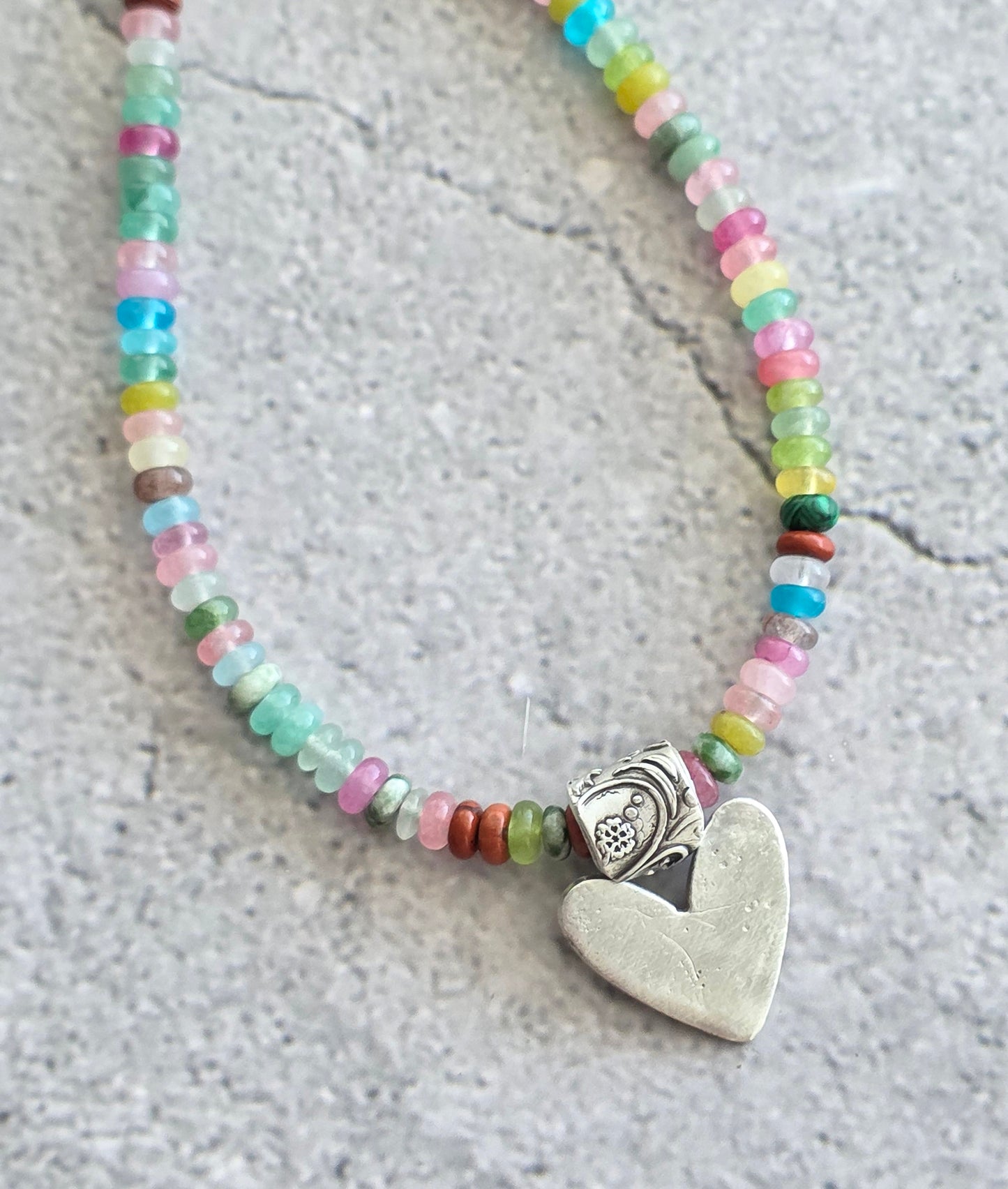 Multi gemstone necklace with fine silver heart and floral bail