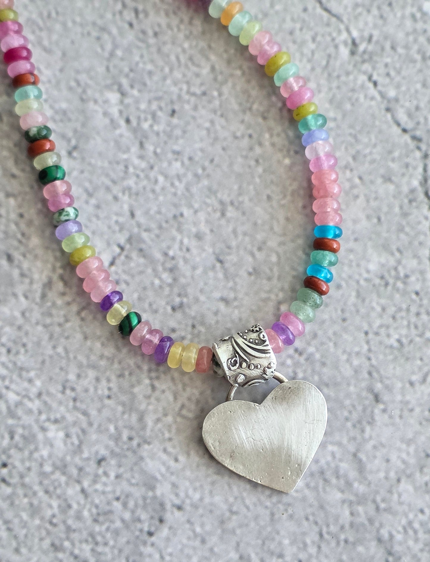 Multi gemstone necklace with fine silver heart and floral bail