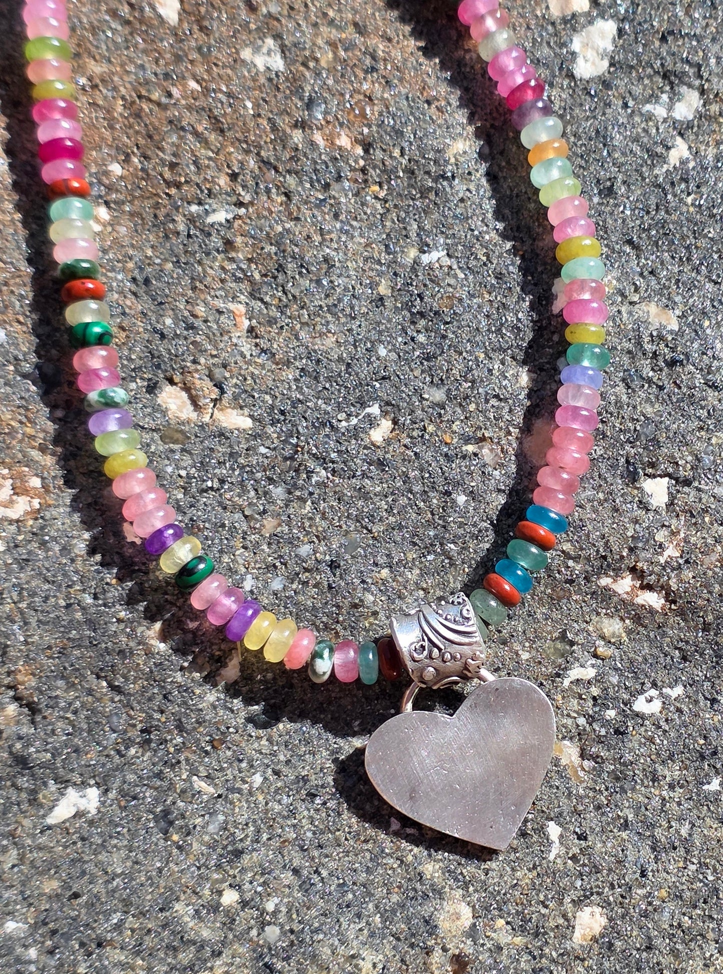 Multi gemstone necklace with fine silver heart and floral bail