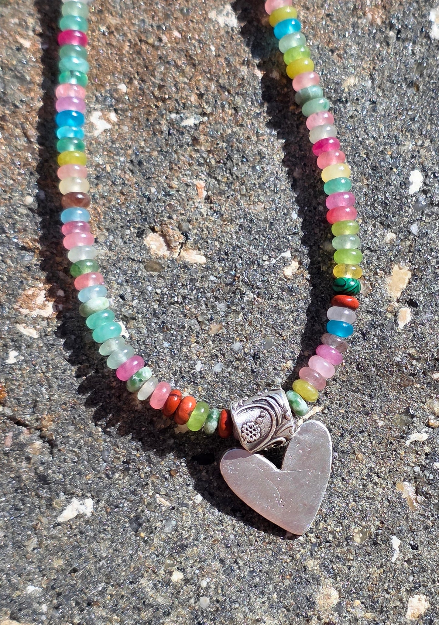 Multi gemstone necklace with fine silver heart and floral bail