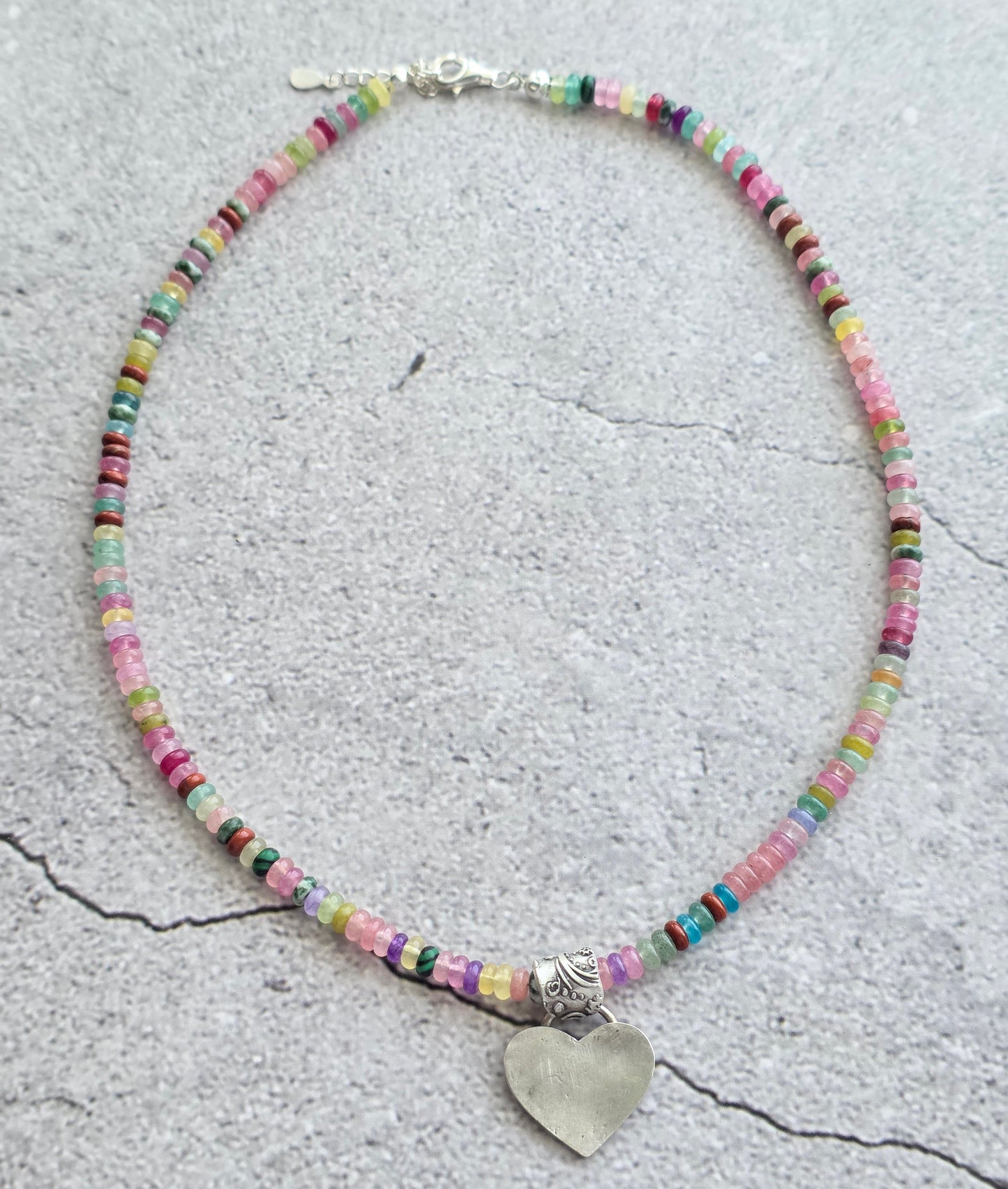 Multi gemstone necklace with fine silver heart and floral bail