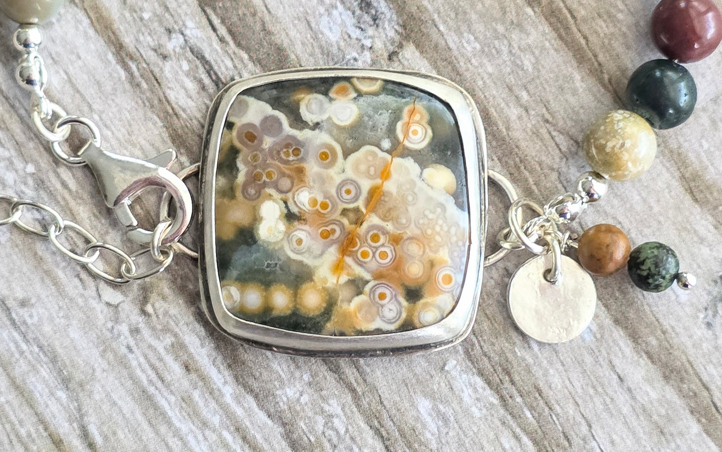 Bezel set Ocean Jasper with Picaso Jasper beads and lots of charms!