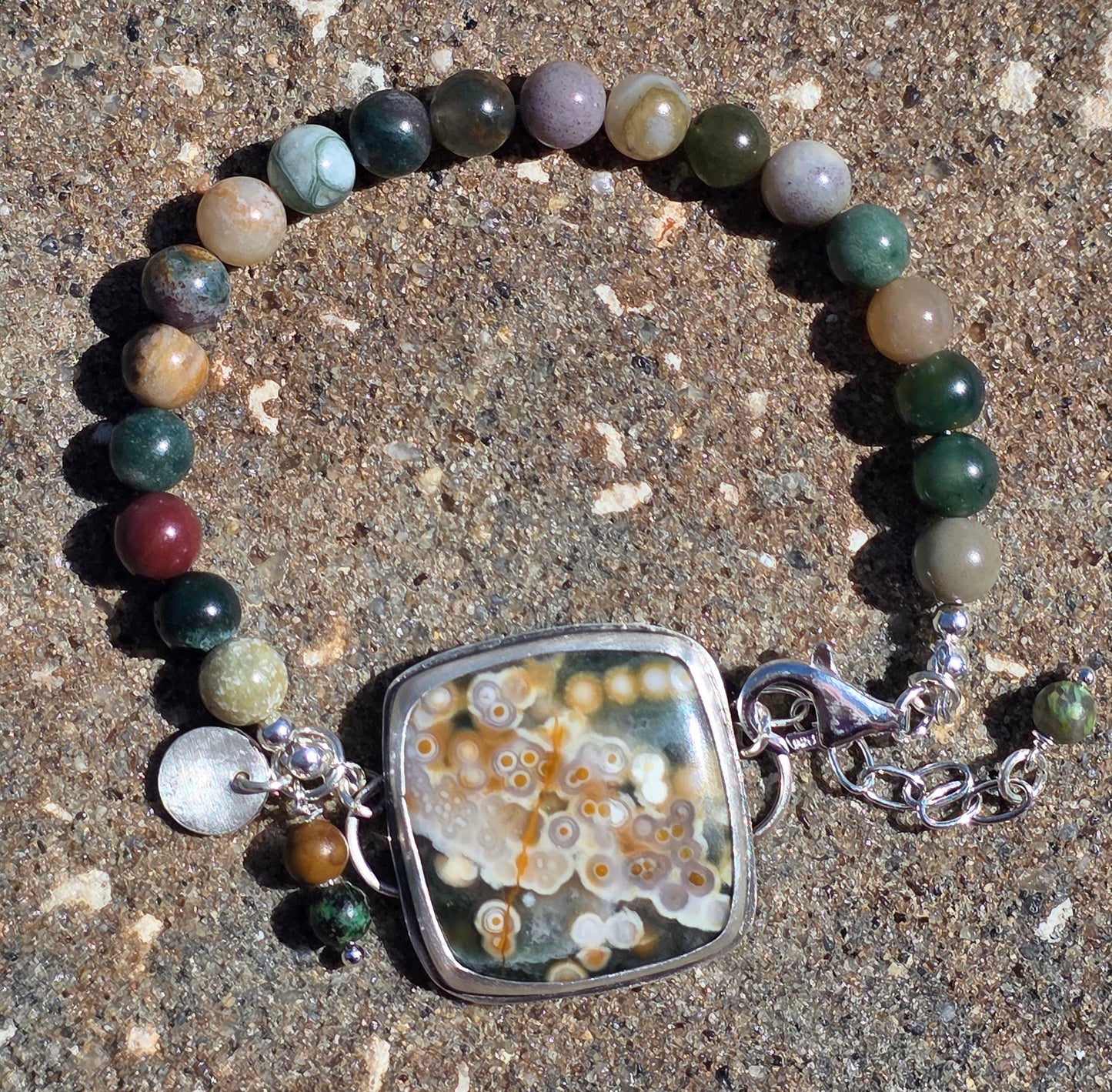 Bezel set Ocean Jasper with Picaso Jasper beads and lots of charms!