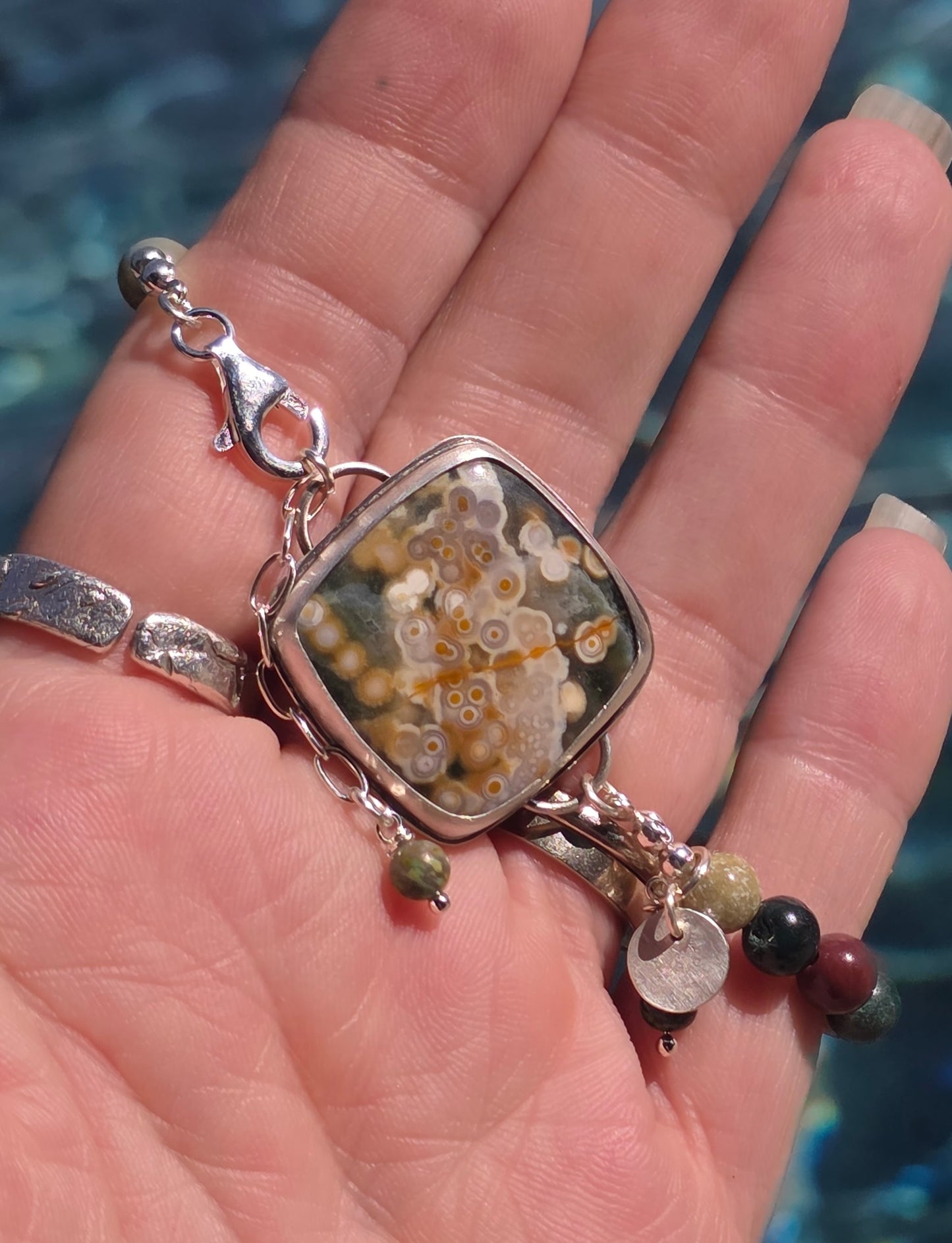 Bezel set Ocean Jasper with Picaso Jasper beads and lots of charms!