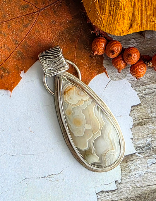 Crazy Lace Agate pendant with fine silver bail