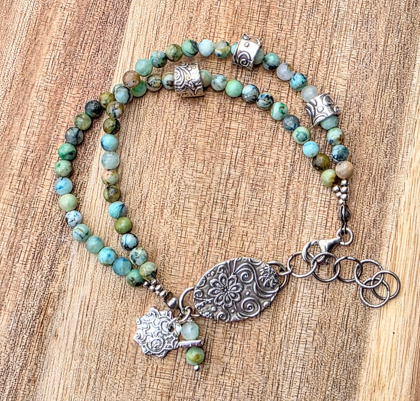 2 strand chrysocolla beaded bracelet with fines silver charms and "floating" silver beads