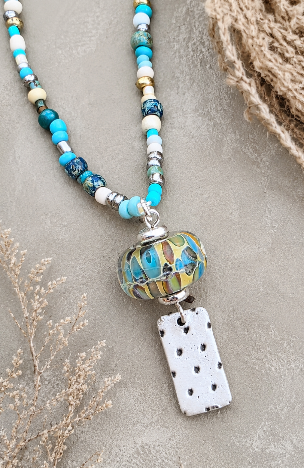 All Blues- Handmade Lampwork Bead with Silver Charm on Beaded Necklace